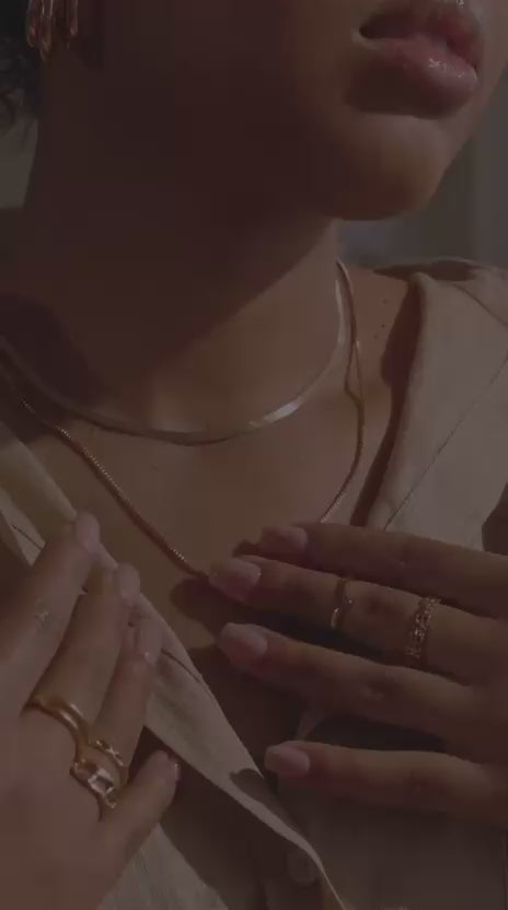 Load video: Sheilla.L Collection jewelry: earrings, layered necklaces, and stacked rings.